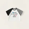 Kids oversized raglan sleeve t-shirt with black striped sleeves and graphic print - 110 / White