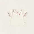 Toddler girl cream cotton short sleeve polo shirt with red piping and strawberry embroidery - 80 / Tops / Off White