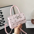 Borsa a tracolla rosa con motivo a fiocchi, trama plissettata e fibbia a farfalla argento - Rosa