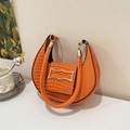 Minimalist bright orange crescent handbag with crocodile texture and unique gold buckle - Orange