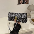 Minimalist leopard print baguette bag with golden buckle hardware for stylish women - Black