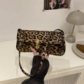 Chic leopard print baguette bag with gold buckle clasp and faux pony hair texture - Brown