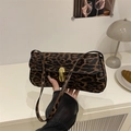 Elegant leopard print baguette bag with a premium gold metal buckle closure detail - Brown