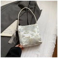 Close-up of white satin shoulder bag featuring elegant blue butterfly embroidery and long tassel - Gold Blue Butterfly (1343040) / Blue