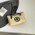 Minimalistische beige shopper met zwarte bies en rond uitgesneden logo op de voorzijde - Khaki & Zwart