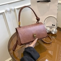 Retro reddish brown crossbody bag with gold twist lock and unique knotted top handle - Brown