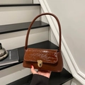 Brown vintage baguette bag with crocodile texture and golden metal lock details - Brown