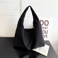 Minimalist large black tote bag in solid color with wide strap for daily commute and leisure - Black