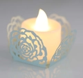 Light blue laser-cut rose hollow paper sleeve with warm yellow LED tea light candle - White