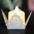 LED flameless candle with white laser cut hollow Christmas tree pattern paper shade - White