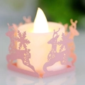 Pink LED candle holder with reindeer and snowflake laser-cut patterns for Christmas decor - Pink