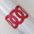 Elegant red laser-cut paper napkin ring with interlaced circle design on satin - Pearlescent Red