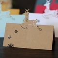 Tarjetas de mesa navideñas cortadas por láser con renos y copos en varios colores - Papel kraft