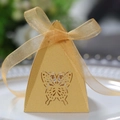 Elegant gold pyramid candy box with hollow butterfly design and ribbon bow detail - Gold