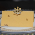 Élégantes marque-places flocon de neige dorés découpés au laser pour table de Noël - Or