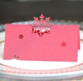 Marque-places flocon de neige en rose nacré découpés au laser pour table de Noël - Rouge Perlé