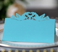 Laser-cut light blue place card featuring heart and dove patterns for wedding table decor - Teal