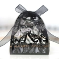 Elegant laser cut black butterfly favor box with black organza ribbon on white background - Black