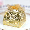 Elegant gold laser-cut hollow wedding favor box with floral patterns and a gold ribbon bow - Reflective Gold