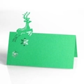 Laser-cut green reindeer seat card with snowflake hollow patterns on white background - Dark Green