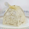 Elegant ivory laser-cut wedding favor box with pearl finish and ribbon bow detail - Jewelry Cream Star