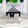 Silver baby shower favor box with bear cutout and ribbon bow on a decorative plate - Reflective Silver