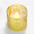 Golden laser-cut metal candle holder with intricate vine patterns and warm LED light - Double Sided Reflective Gold
