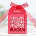 Elegant red laser-cut wedding favor box with rose patterns and a red organza ribbon bow - Pearlescent Red