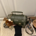 Dark green cylinder crossbody bag with vintage rivets and colorful wide shoulder strap - Green