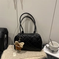 Quilted black tote bag with shoulder straps and a cute brown plush monster charm - Black
