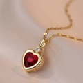 Elegant gold titanium necklace featuring a red heart gemstone and a clear zircon stone - Red Zirconia Style