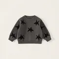 Pull en tricot gris foncé pour enfants avec motif étoiles noires et col rond côtelé - 80 / gris foncé