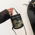 Chic black leather bucket bag with elegant butterfly embroidery and a top handle - Black & Gold