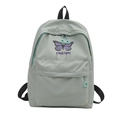 Cute mint green school backpack featuring purple butterfly print and dream text design - Green