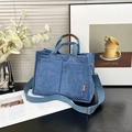 Blue corduroy tote bag for women with dual handles and adjustable strap in a lifestyle setting - Blue