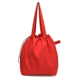 Red nylon bucket tote bag with drawstring closure and textured fabric finish - Red
