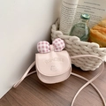 Pink mini crossbody bag with plaid bow and cat embroidery on a wooden table - Pink