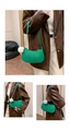 Detail of green crescent shoulder bag with V-shaped quilting and soft white fur ball charm - With Fur Pom-pom / Green