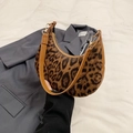 Chic leopard print crescent underarm bag with brown leather strap and gold hardware - Brown