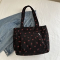Large black corduroy tote bag with red strawberry print and functional front pockets - Black