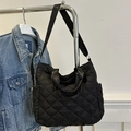 Black quilted tote bag with diamond stitching and adjustable strap in casual style - Black