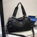 Bolso de viaje grande en nailon negro impermeable con correa de hombro y emblema - Negro