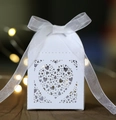 White heart-shaped laser-cut wedding candy box with elegant organza ribbon bow - White