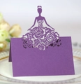 Detail of purple laser cut place card with lady silhouette and floral pattern on plate - Deep purple