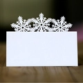 Laser cut white snowflake place cards for Christmas weddings and festive events - White