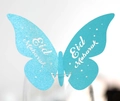 Macro detail of light blue butterfly glass card with Eid Mubarak print and glitter finish - Turquoise Blue