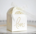 Cream pearl paper wedding candy box with gold hollow Love text and white ribbon - Ivory
