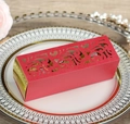 Red laser cut wedding favor box with gold trim featuring intricate floral patterns - Pearlescent Red