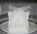 Elegant white laser-cut wedding favor box with Love hollow design and silver ribbon - Ivory