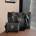 Detail of black tote bag set with monogram M pattern and gold chain hardware accents - Printed Tote Bag Two-piece Set / Black